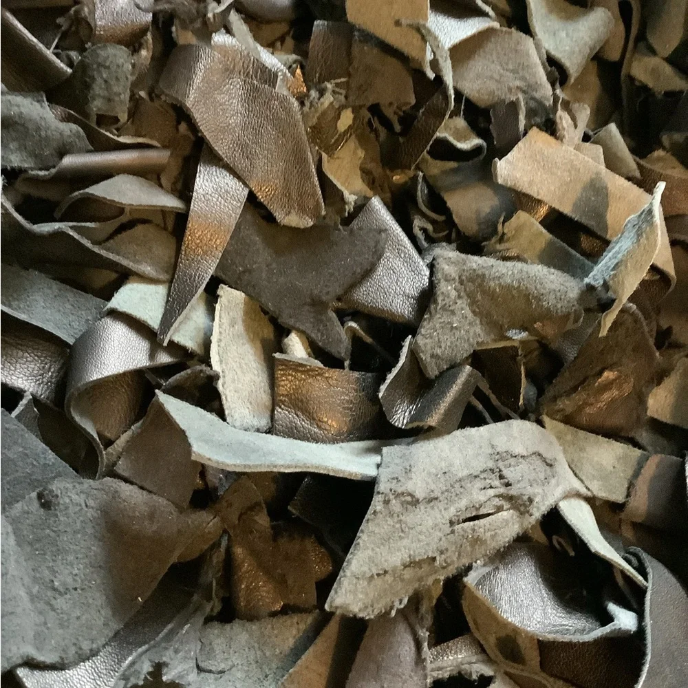 Leather scraps rug 20” by 37 1/2”